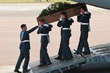 thumbnail: BRIZE NORTON, ENGLAND - JULY 01:  The coffin of Denis Thwaites, one of the victims of last Friday's terrorist attack, is taken from the RAF C-17 aircraft at RAF Brize Norton in Tunisia, on July 1, 2015 in Brize Norton, England. British nationals Adrian Evans, Charles Evans, Joel Richards, Carly Lovett, Stephen Mellor, John Stollery, and Denis and Elaine Thwaites are the first of the victims of last week's terror attack to be repatriated.  (Photo by Joe Giddens-WPA Pool/Getty Images)