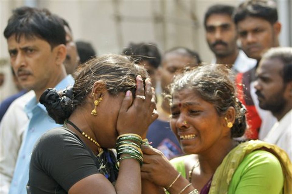 Sharda Janardhan Chitikar, left, is consoled by a relative as she grieves the death of her two children in a terrorist attack as she waits for their bodies outside St. Georges Hospital in Mumbai, India, Thursday, Nov. 27, 2008. Teams of gunmen stormed luxury hotels, a popular restaurant, a crowded train station and a Jewish group's headquarters, killing people, and holding Westerners hostage in coordinated attacks on the nation's commercial center that were blamed on Muslim militants. (AP Photo/Gurinder Osan)