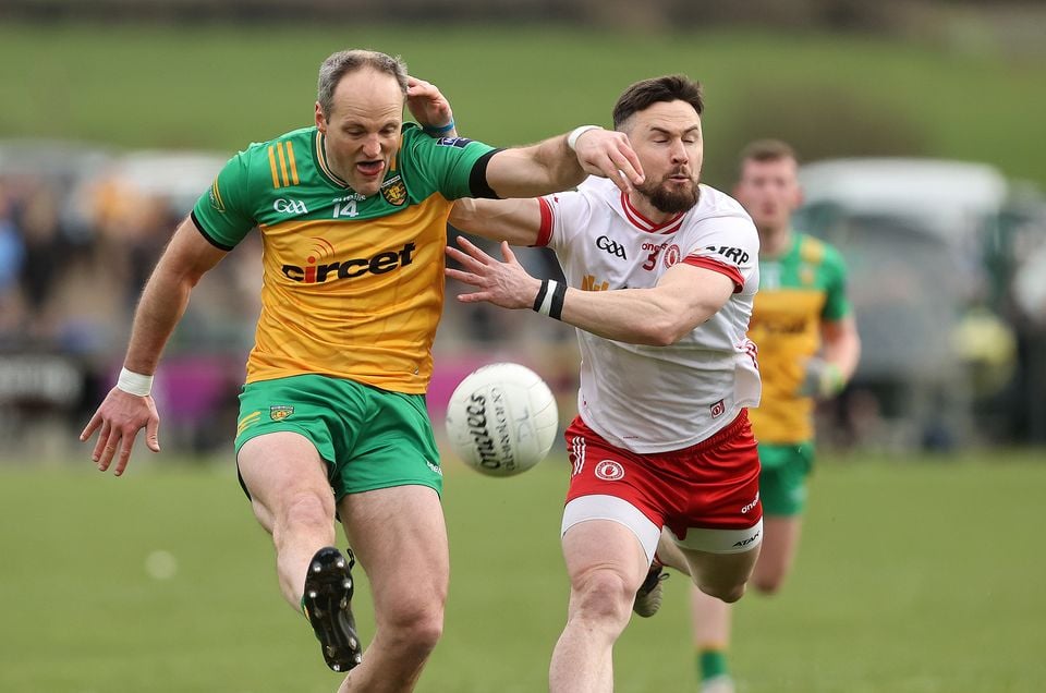 Donegal's Michael Murphy and Peter Teague of Tyrone