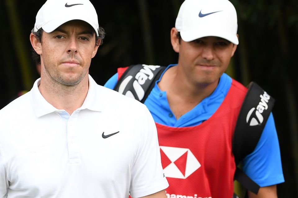SHANGHAI, CHINA - NOVEMBER 03: Rory McIlroy of Northern Ireland and caddie Harry Diamond walk from the fourth tee during Day Four of the WGC HSBC Champions at Sheshan International Golf Club on November 03, 2019 in Shanghai, China. (Photo by Ross Kinnaird/Getty Images)