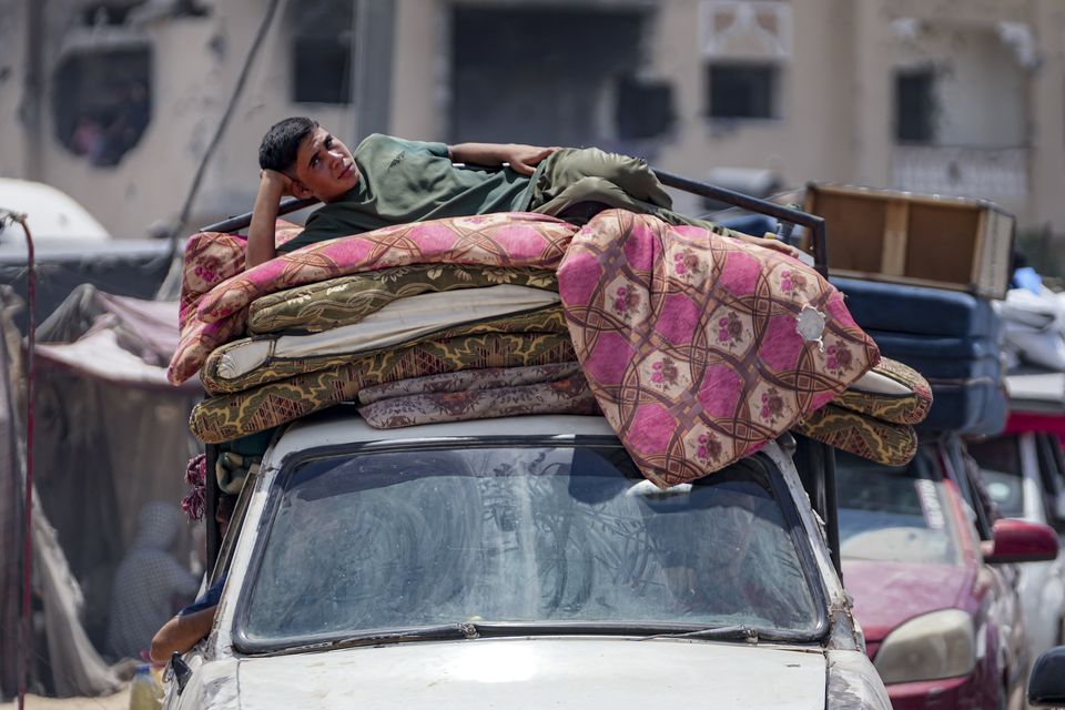 Palestinians flee Hamad City, following an evacuation order by the Israeli army to leave parts of the southern area of Khan Younis (Abdel Kareem Hana/AP)