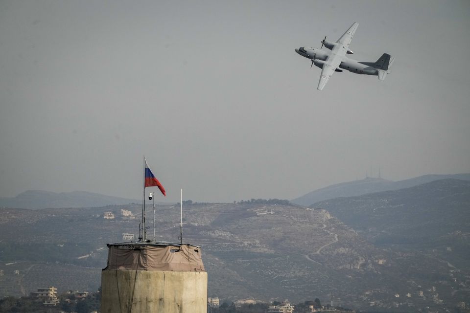 A Russian aircraft takes off at Hmeimim Air Base (Leo Correa/AP)