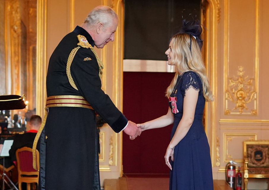 Lissie Harper was made an MBE by the King at Windsor Castle (Jonathan Brady/PA)