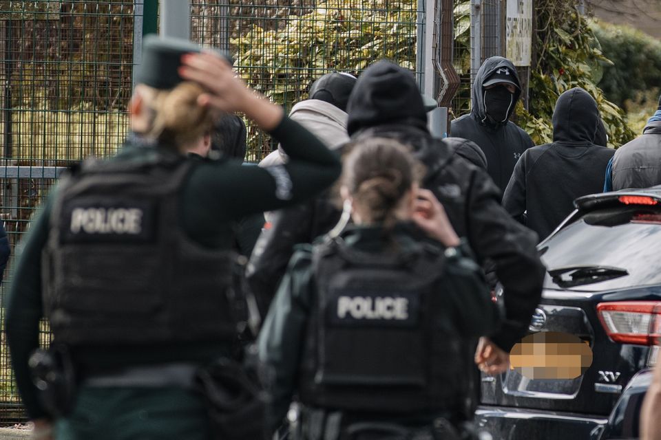 Police deal with a number of masked men approaching Weavers Grange in Newtownards on 30 March 2023 (Photo by Kevin Scott for Belfast Telegraph)