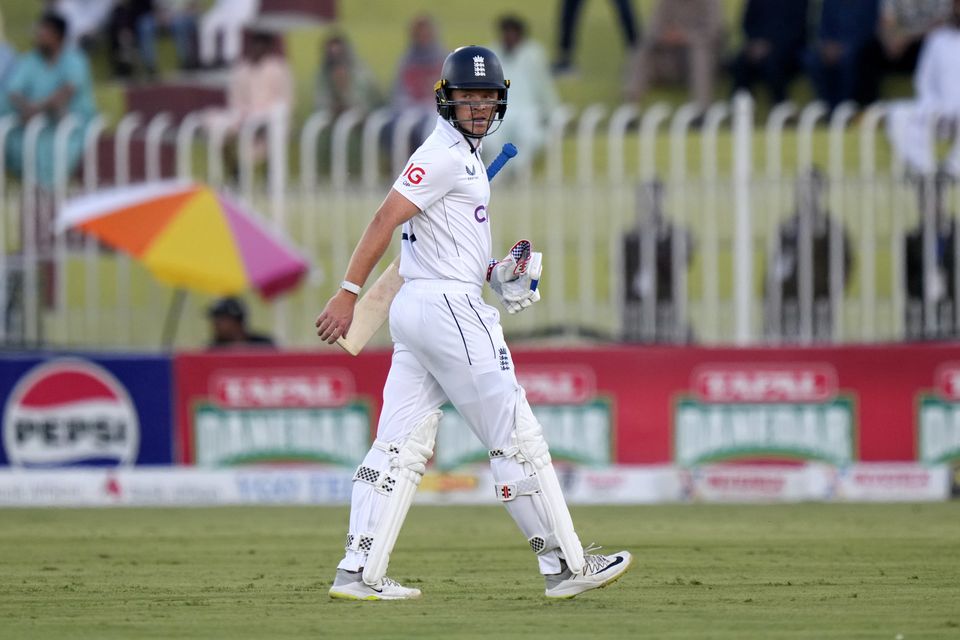 England’s Ollie Pope reacts as he walks off the field (Anjum Naveed/AP)