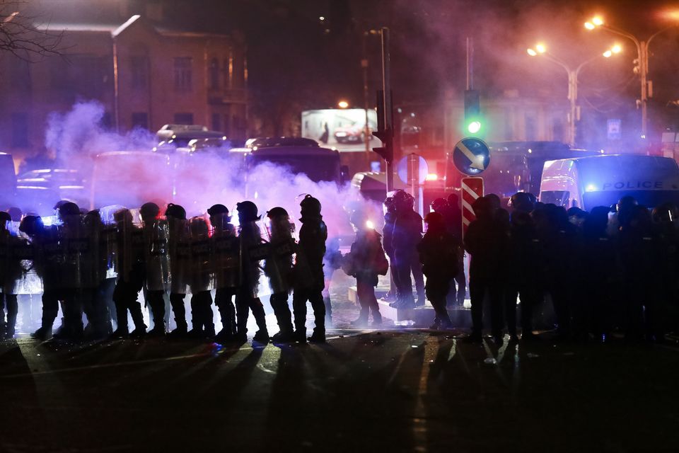 Police block a street in Tbilisi to prevent protesters rallying against the government’s decision to suspend negotiations on joining the EU (Zurab Tsertsvadze/AP)