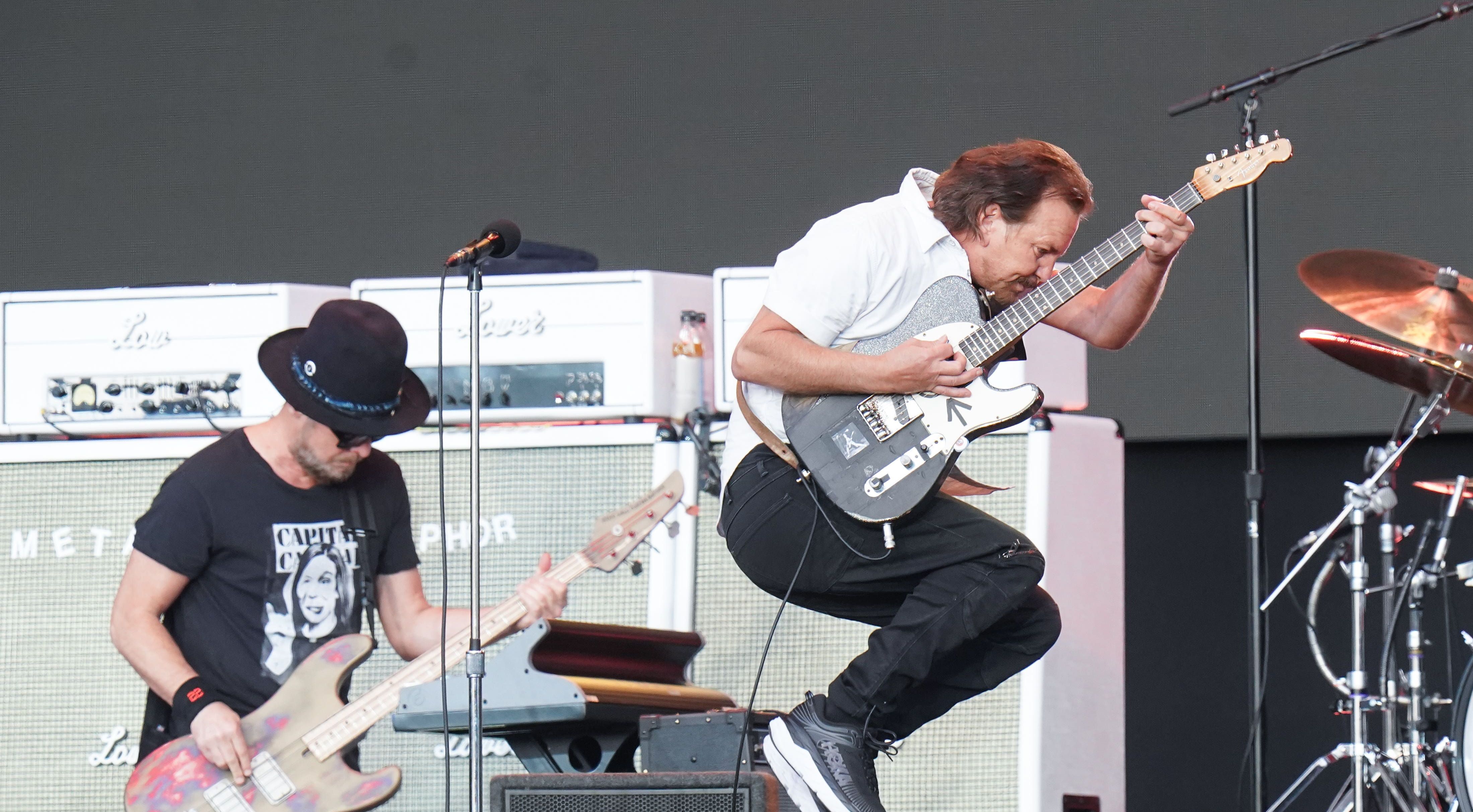 Eddie Vedder, third from left, and Mike McCready, left, both of