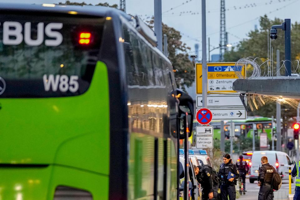 German police officers stop a bus at the border between Germany and France in Kehl, Germany (Michael Probst/AP)