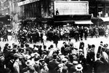 thumbnail: Crowds gather around the bulletin board of the New York American newspaper in New York, where the names of people rescued from the sinking Titanic are displayed.
