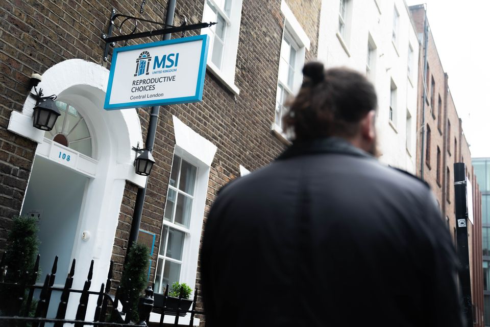 An anti-abortion protester waits outside the MSI Reproductive Choices clinic in central London (James Manning/PA)