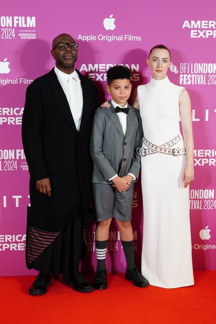 Sir Steve McQueen, Elliott Heffernan and Saoirse Ronan attend the BFI London Film Festival opening night gala of documentary film maker and director Steve McQueen’s Second World War drama Blitz, at the Royal Festival Hall (Ian West/PA)