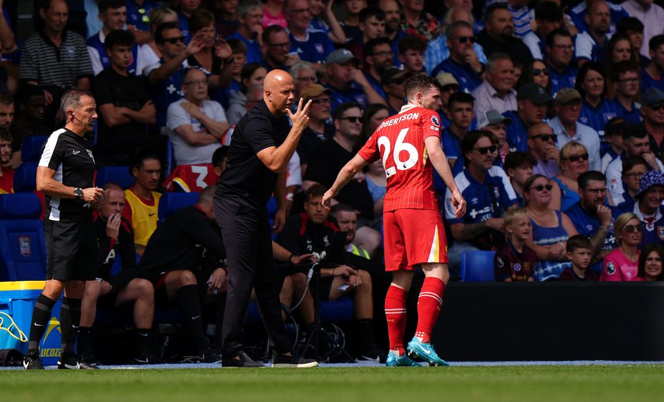 Liverpool boss Arne Slot speaks to Andrew Robertson (Bradley Collyer/PA)