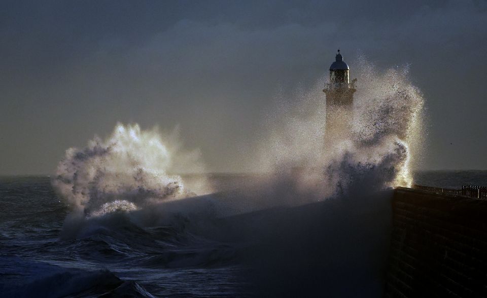 Waves batter Tynemouth pier lighthouse in Tyne and Wear (Owen Humphreys/PA)