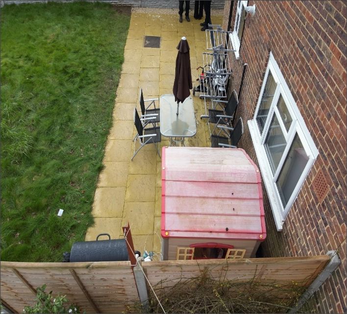 The rear garden of the family house on Hammond Road in Woking, Surrey, where the body of 10-year-old Sara Sharif was found under a blanket in a bunk bed (Surrey Police/PA)