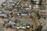 thumbnail: An aerial view shows residential area affected by tsunami in Sendai, northern Japan Saturday, March 12, 2011  after Japan's biggest recorded earthquake slammed into its eastern coast Friday