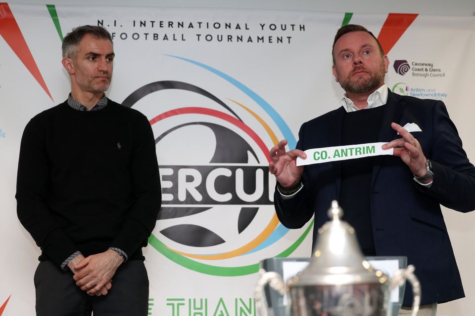 Former Northern Ireland International Aaron Hughes takes part in the draw with Ross Lazaroo-Hood from Clearer Water