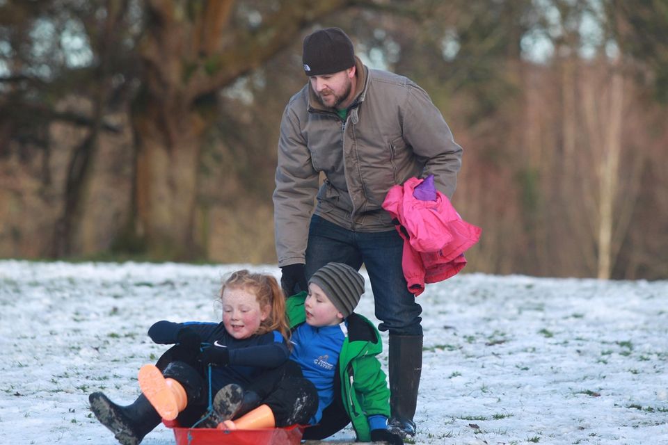 10/12/17
PACEMAKER PRESS 
People make the best of the snow in the grounds of Stormont. Brian Buckley with his two children Finn and Jenna take their sled out.
PICTURE MATT BOHILL PACEMAKER PRESS