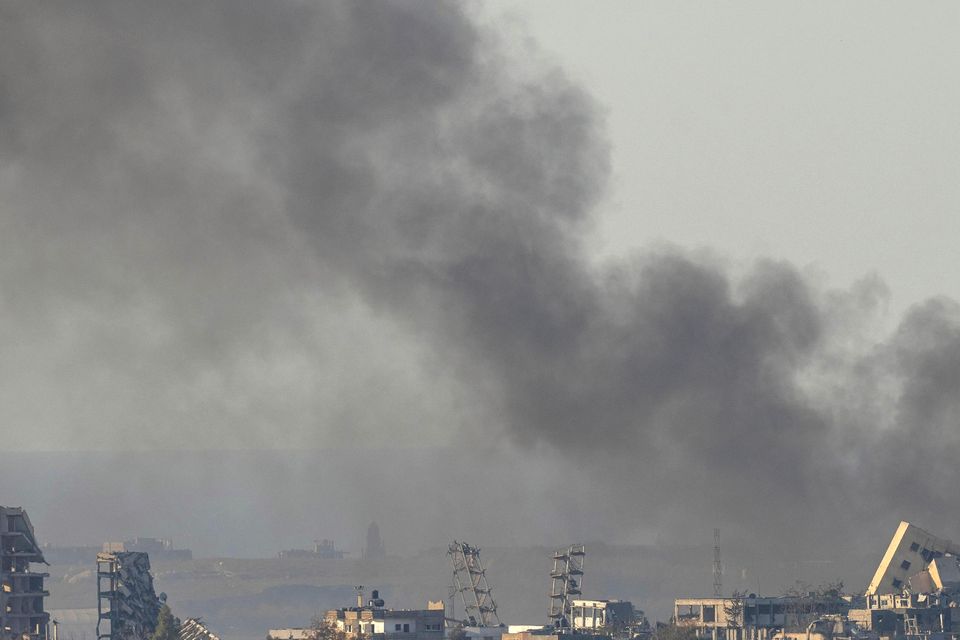 Smoke rises following an explosion in the Gaza Strip earlier this month (Ohad Zwigenberg/AP)