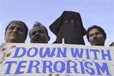 thumbnail: Indian Muslims,protest against terrorist attacks in Mumbai, as a placard reads " Kill terror not terrorist " in Ahmadabad, India, Saturday, Nov. 29, 2008. Indian commandos killed the last remaining gunmen holed up at a luxury Mumbai hotel Saturday, ending a 60-hour rampage through India's financial capital by suspected Islamic militants that killed people and rocked the nation. (AP Photo/Ajit Solanki)