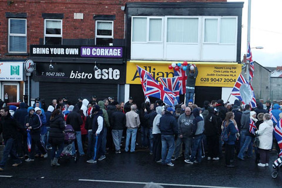 Northern Ireland- 4th December 2012 Mandatory Credit - Photo-Jonathan Porter/Presseye.  Loyalist hold protest at Naomi Long's east Belfast Alliance office following a council vote last night which will see the Union Flag only follow certain days.  Loyalist protesters pictured on the Newtownards Road during the protest.