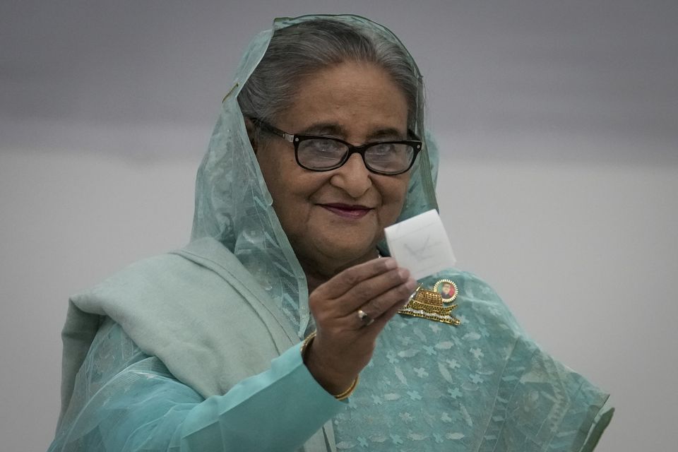 Bangladesh Prime Minister Sheikh Hasina casting her vote in the election in January (Altaf Qadri/AP)