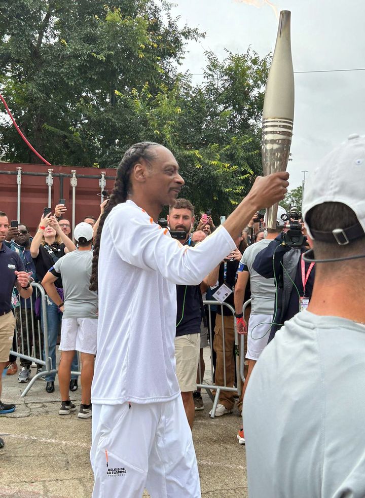 Crowds cheer as Snoop Dogg carries Olympic torch for Paris 2024 Games