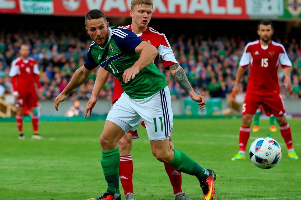 Northern Ireland's Conor Washington (left) and Belarus' Nikita Korzun battle for the ball during the International Friendly at Windsor Park, Belfast. PRESS ASSOCIATION Photo. Picture date: Friday May 27, 2016. See PA story SOCCER N Ireland. Photo credit should read: Niall Carson/PA Wire. RESTRICTIONS: Editorial use only, No commercial use without prior permission, please contact PA Images for further information: Tel: +44 (0) 115 8447447.