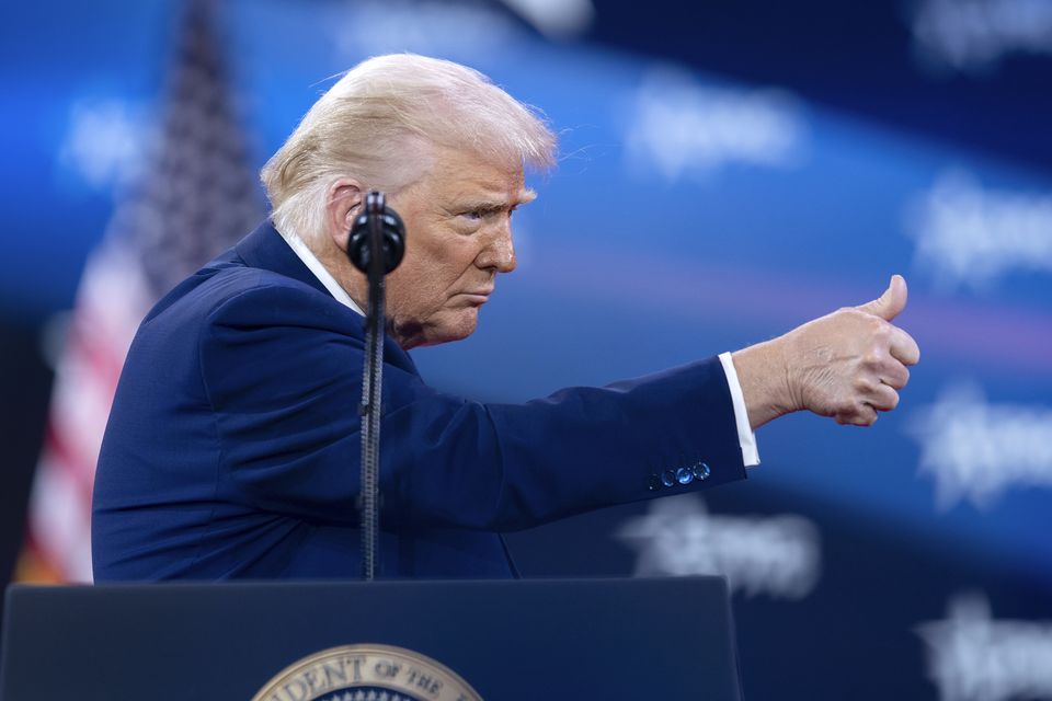 President Donald Trump gives a thumbs-up as he speaks at the Conservative Political Action Conference (Jose Luis Magana/AP)