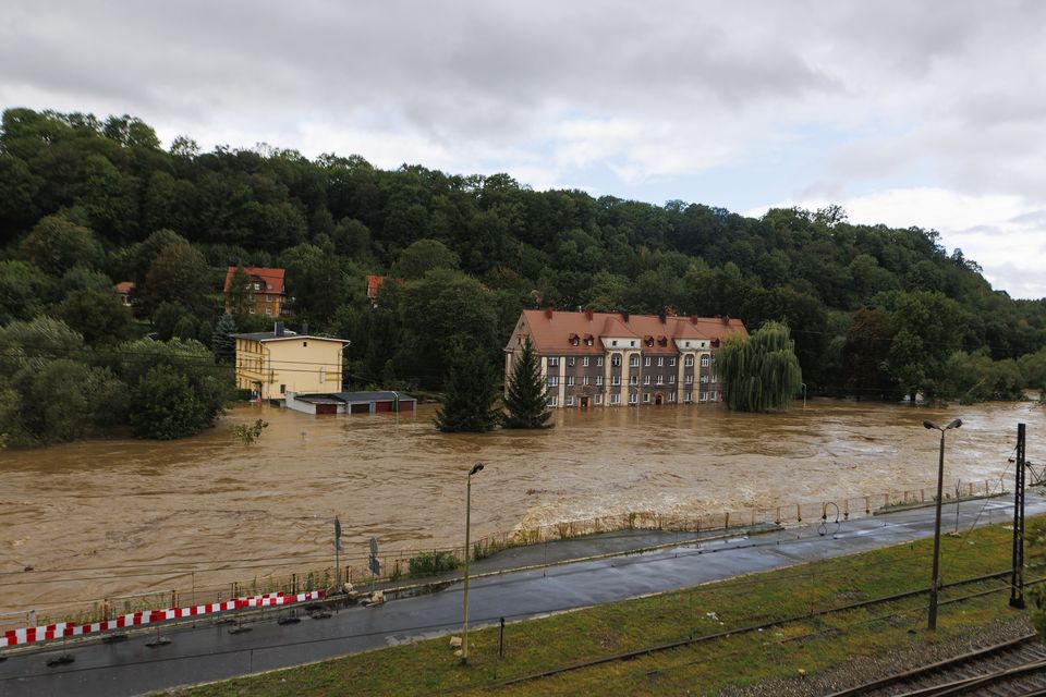 Garages and a house flooded in the town of Klodzko in Poland’s south west (Krzysztof Zatycki/AP)