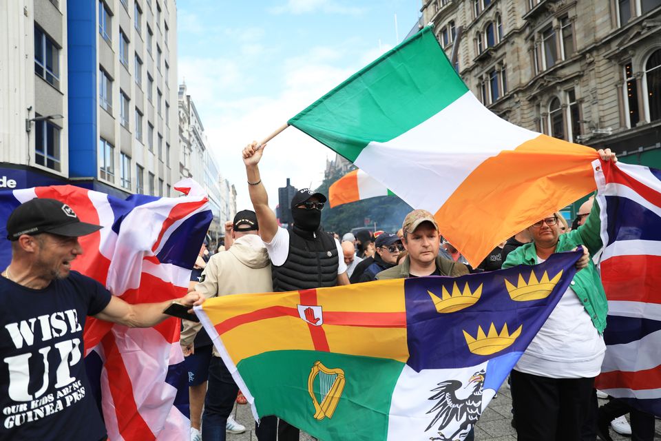 People taking part in an anti-immigration protest outside Belfast City Hall on August 3 (PA)