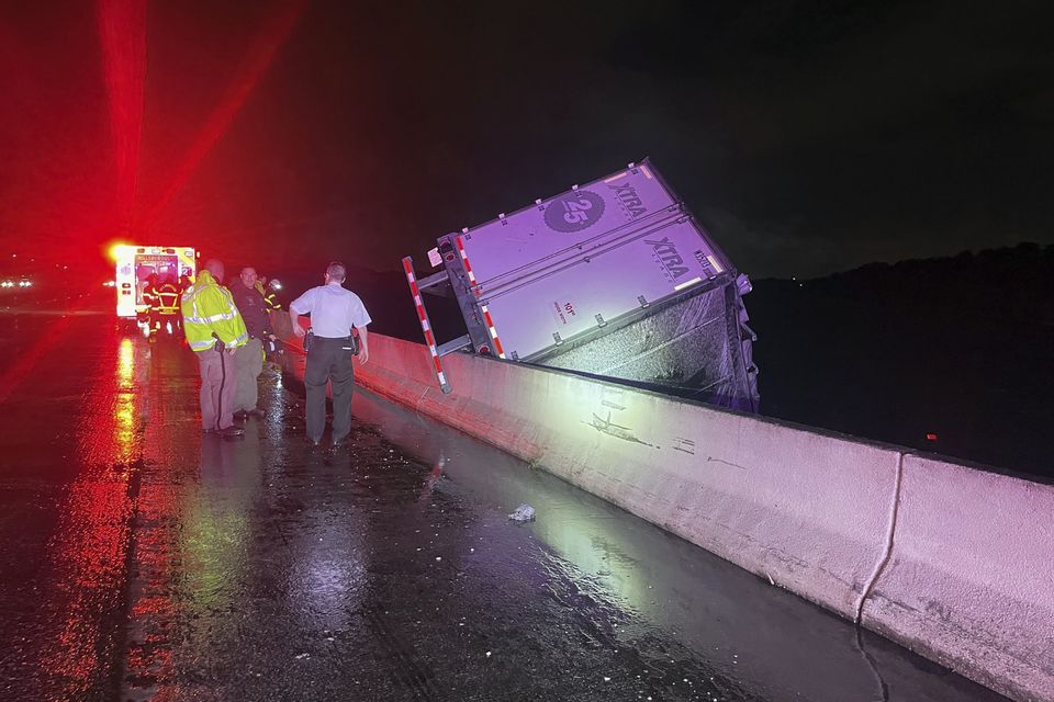 A tractor trailer dangles from a bridge near Tampa, Florida (Florida Highway Patrol/AP)