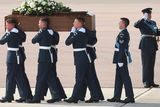 thumbnail: BRIZE NORTON, ENGLAND - JULY 01:  The coffin of John Stollery, one of the victims of last Friday's terrorist attack, is taken from the RAF C-17 aircraft at RAF Brize Norton in Tunisia, on July 1, 2015 in Brize Norton, England. British nationals Adrian Evans, Charles Evans, Joel Richards, Carly Lovett, Stephen Mellor, John Stollery, and Denis and Elaine Thwaites are the first of the victims of last week's terror attack to be repatriated.  (Photo by Joe Giddens-WPA Pool/Getty Images)