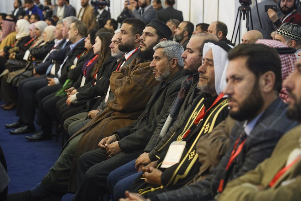 Participants attend Syria’s national dialogue conference at the People’s Palace in Damascus (Omar Albam/AP)