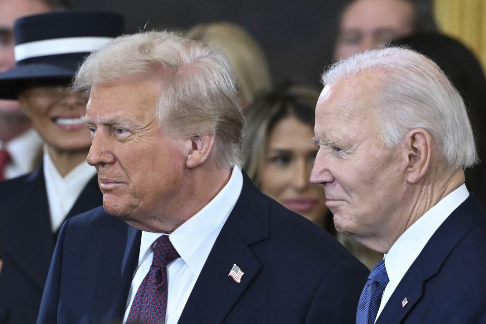 Joe Biden and Donald Trump stand together (Saul Loeb/Pool photo via AP)