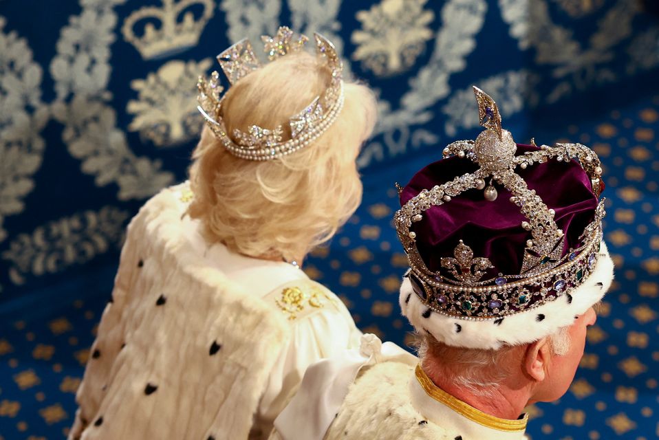 The Queen and King in their royal regalia (Hannah McKay/PA)