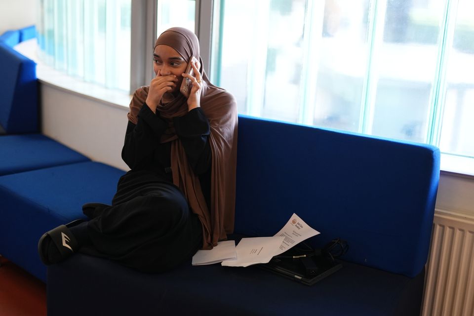 This student at the Ark Globe Academy in south-east London appeared emotional as she called her parents (Jordan Pettit/PA)