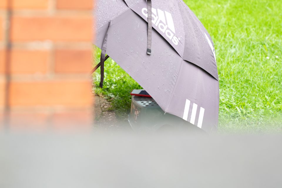 A mobile phone underneath an umbrella was pictured in Chen and Lu’s garden playing loud music to disturb their neighbours (Lincolnshire Police/PA)