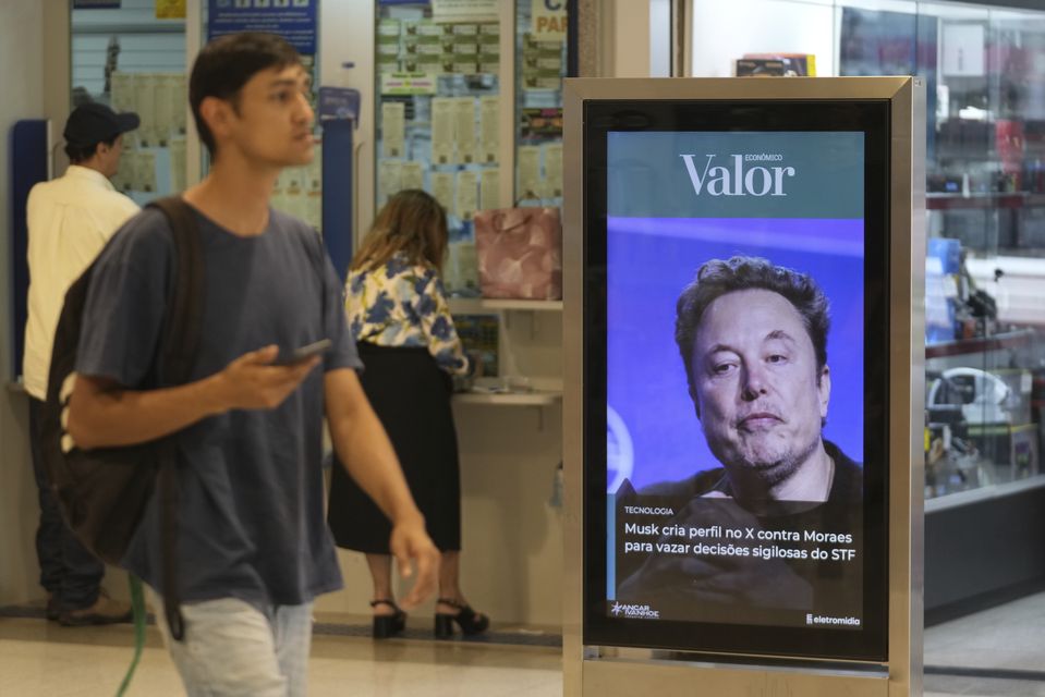 A photo of Elon Musk at a shopping centre in (Eraldo Peres/AP)