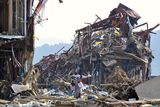 thumbnail: A man walks amid the rubble in Minamisanriku town, Iwate prefecture, northern Japan, Sunday, March 13, 2011, two days after a powerful earthquake and tsunami hit the country's east coast. (AP Photo/Kyodo News) JAPAN OUT, MANDATORY CREDIT, NO SALES IN CHINA, HONG  KONG, JAPAN, SOUTH KOREA AND FRANCE