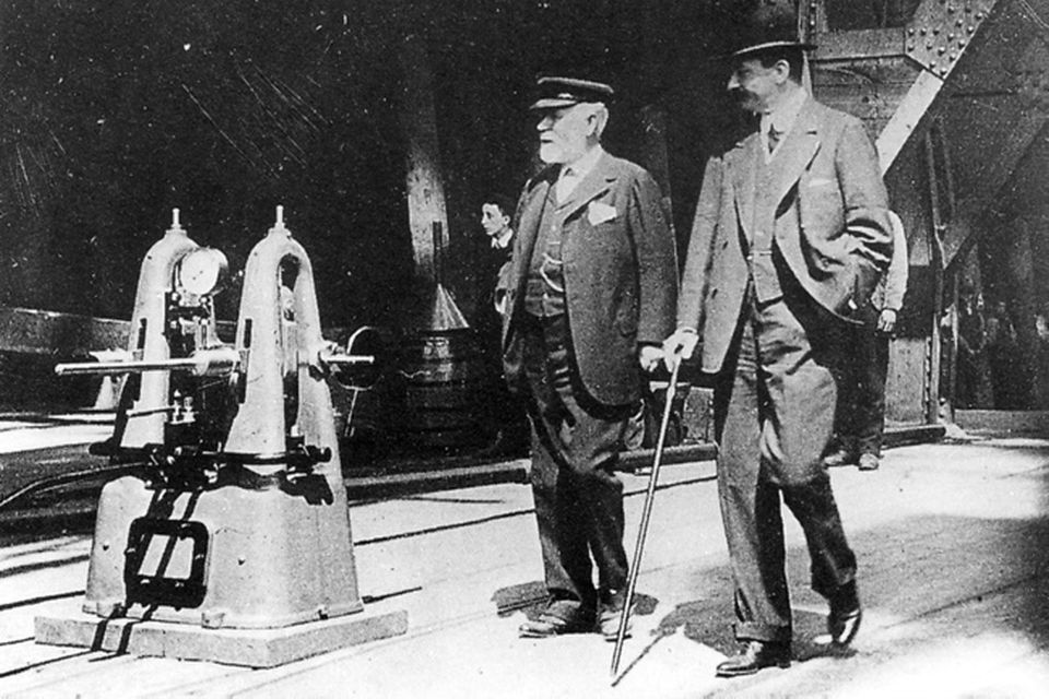 Lord Pirrie, chairman of H&W (left) and Bruce Ismay, chairman of White Star, make a final tour of inspection of Titanic before her launch.  31/5/1911. Photograph © National Museums Northern Ireland. Collection Ulster Folk & Transport Museum