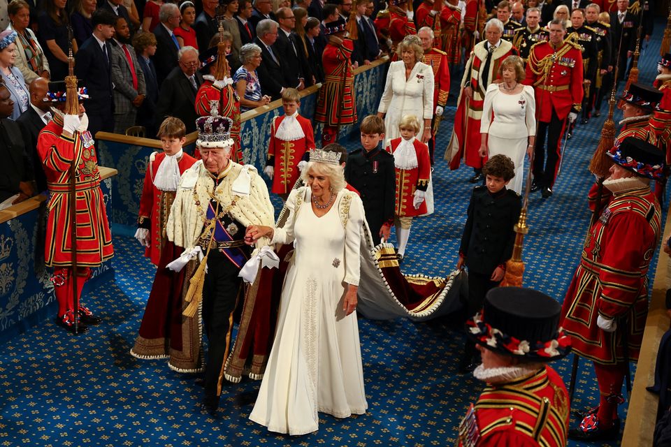 The King, wearing the Imperial State Crown and the Robe of State, and Queen, wearing the George IV State Diadem, leave after the State Opening of Parliament (Hannah McKay/PA)