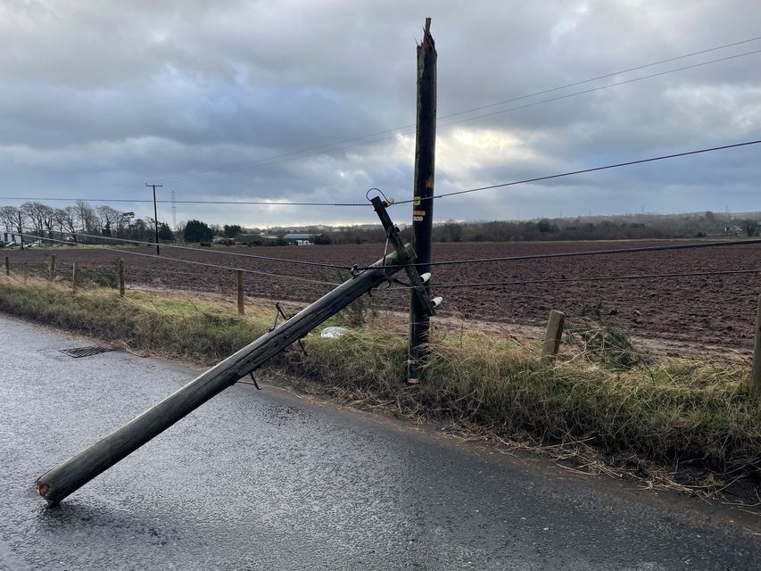 A broken telegraph pole on Blaris Road, Co Antrim (Jonathan McCambridge/PA)