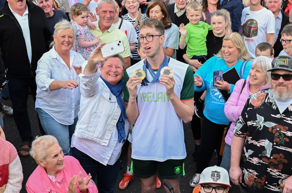 A supporter takes a selfie with Daniel Wiffen. (Pic: Stephen Hamilton)