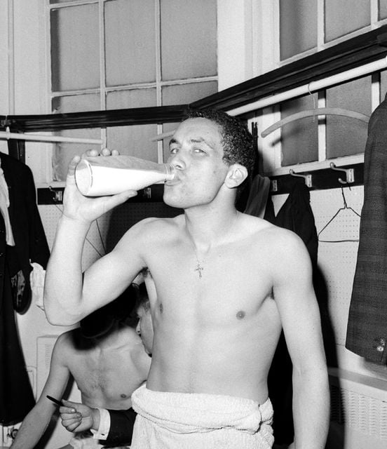 Everton’s Mike Trebilcock, pictured in 1966, celebrates with a pint of milk (PA)