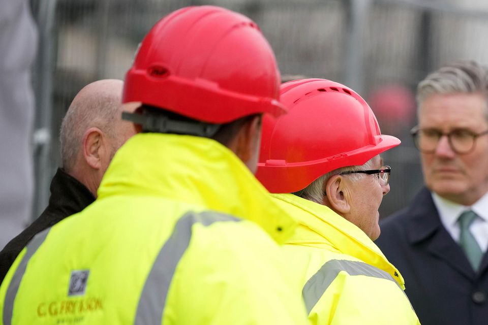 The King, accompanied by Sir Keir Starmer, chats to construction workers at Phase 8A, the next building phase (Alastair Grant/PA)