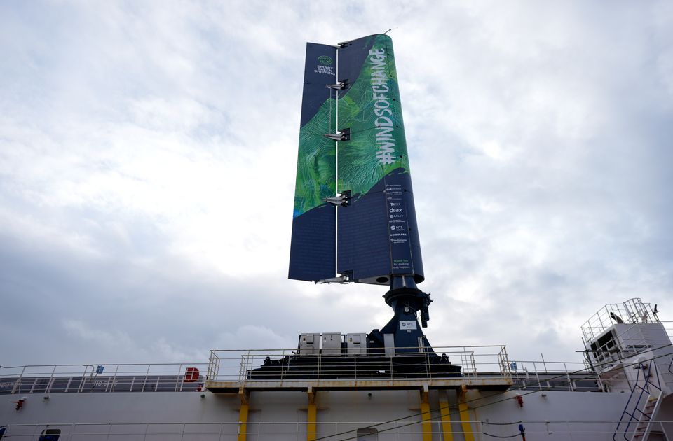 A FastRig test sail developed by Smart Green Shipping, after being lifted into position on the Pacific Grebe, after docking in Southampton for sea trials (Andrew Matthews/PA)