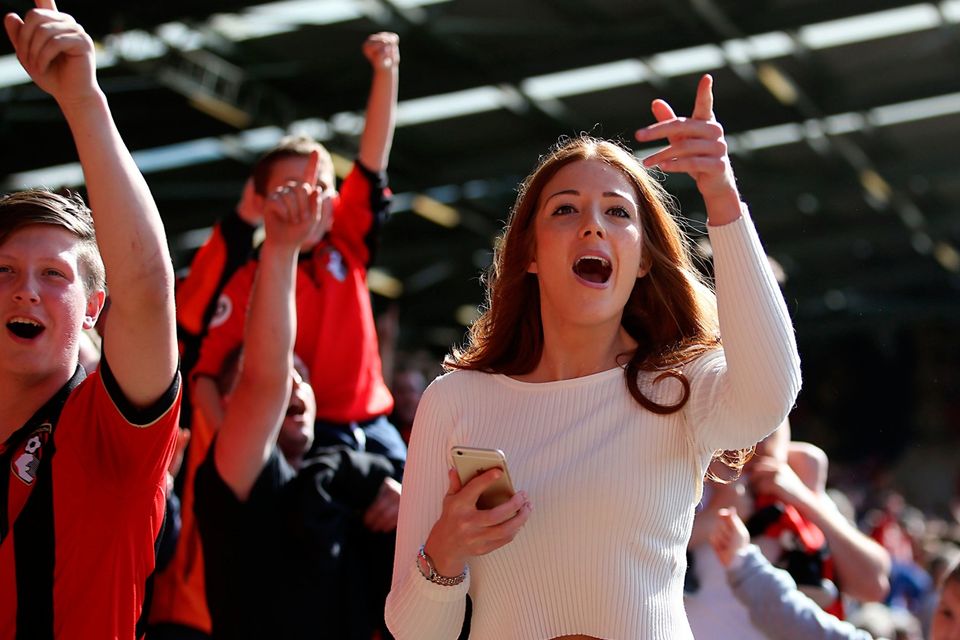 The beautiful game - football fans from around the world -  Bournemouth fans celebrate their sides second goal in the stands during the Premier League match at the Vitality Stadium, Bournemouth.