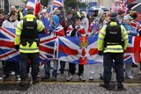 thumbnail: Loyalist protestors and PSNI officers pictured at Belfast City Hall on 22 December 2012