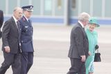 thumbnail: Britain's Queen Elizabeth II and the Duke of Edinburgh are greeted by Tanaiste Eamon Gilmore (front) upon arrival at Casement Aerodrome, Baldonnel, ahead of a four day state visit.