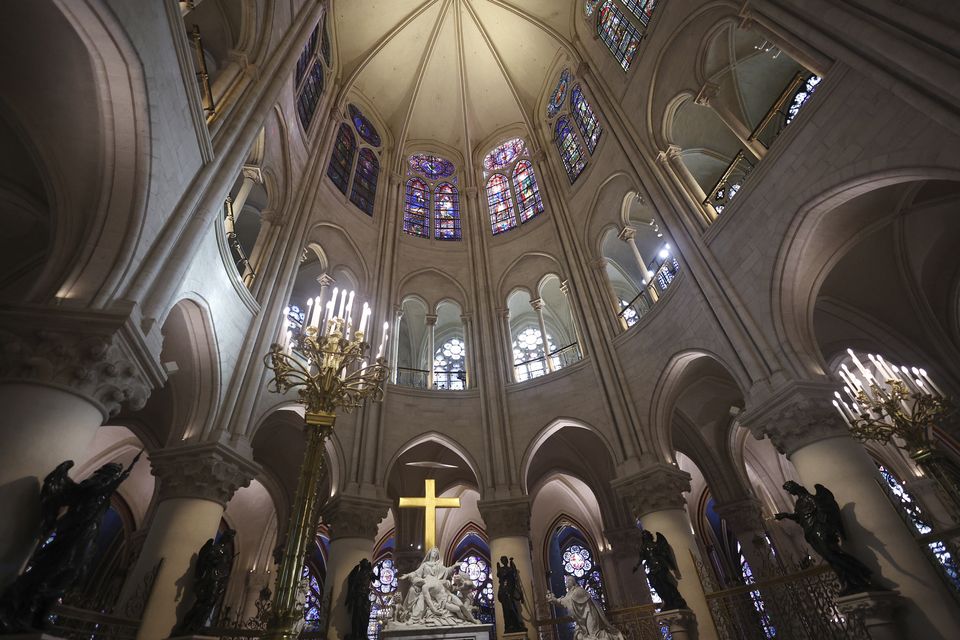 The rebuilt soaring ceilings and cream stonework erase sombre memories of the devastating fire in 2019 (Christopher Petit Tesson, pool via AP)